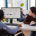 businesswoman-discussing-with-disabled-woman